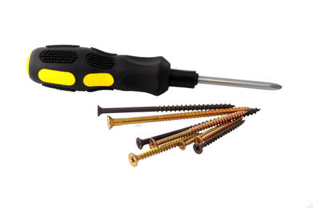 Screwdriver and some screws isolated on white background horizontallyの写真素材