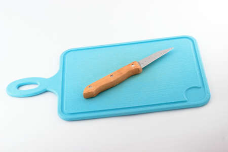Closeup image of kitchen knife on chopping blockの写真素材