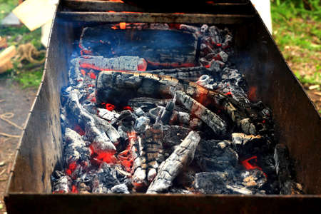 Burning charcoal in the background in barbecueの写真素材
