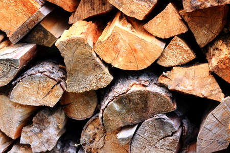 Firewood stacked together pile of heating during cold weatherの写真素材