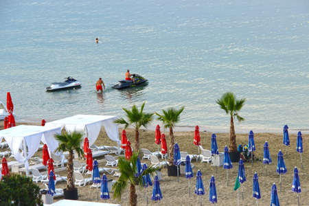 A man riding a water scooter on the beachの写真素材