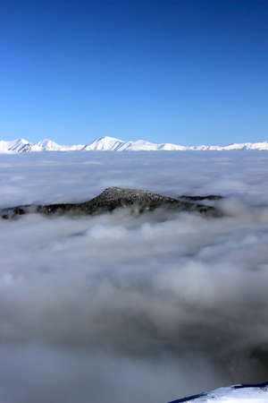 Snowy mountains covered with clouds Tatras Slovakiaの写真素材