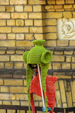 funny green hat on the brick wall backgroundの写真素材
