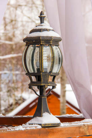 Antique frosty lamp and beautiful snow coveredの写真素材