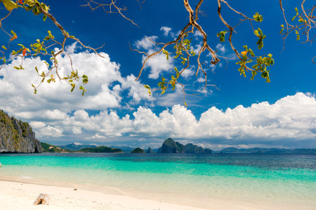 Beautiful picturesque sand beach. Turquoise waters, blue sky