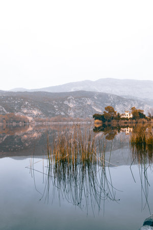 Reflection in the water of a lake in the mountains in winter.の写真素材