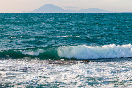 Beautiful seascape with blue sea and mountains in the backgroundの写真素材