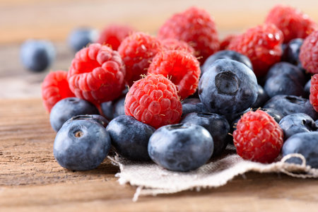 Fresh blueberry close-up on an old wooden background. Fresh blueberries. Blueberry. Fresh...