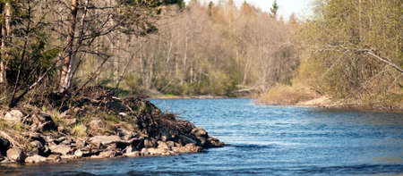 Landscape shot of a calm spring made in early spring day.の写真素材