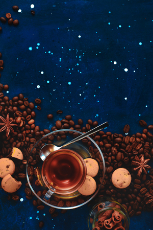 Glass espresso cup in a curved composition with copy space. Top view dark food photography. Creative barista concept.の写真素材