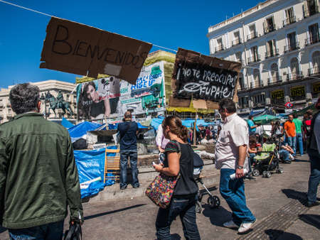protesters and banners at Puerta del Sol on 15M, Madrid, Spainのeditorial素材