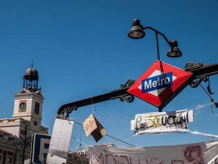 Puerta del Sol metro with banner. 15 M. Madrid. Spainのeditorial素材