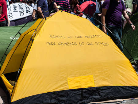 Campaign store with a message at Madrid's Puerta del Sol. 15 M. Spain. We are what we do to change what we areのeditorial素材