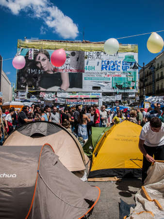 tents and protesters at Puerta del Sol in Madrid at 15M. Spainのeditorial素材