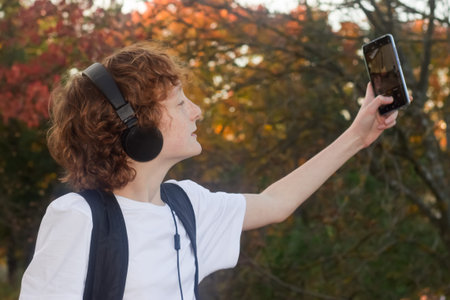 Teen takes selfie on a mobile phone