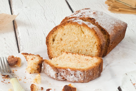Empty space for text. A sponge cake on a white-board table.
