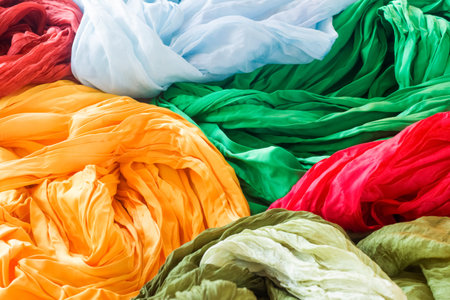 Bright silk scarves, yellow, blue, red, green.の写真素材