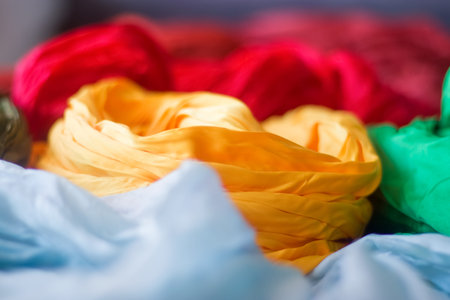 Bright silk scarves, yellow, blue, red, green.の写真素材