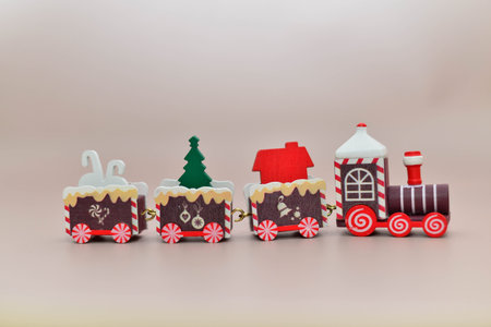 A Christmas train on the beige background. horizontal frame. new years layout.