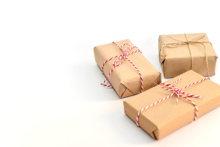 Christmas gifts on the white background. Copy space. Horizontal frame.