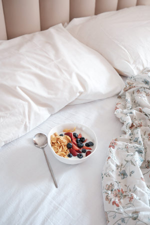 Enjoy a Cozy Breakfast in Bed, Featuring Fresh Fruits and Crunchy Granola for Delight