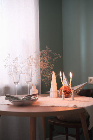 An Elegant Autumn Table Setting featuring Decorative dried Branches along with Beautiful Glasswareの写真素材