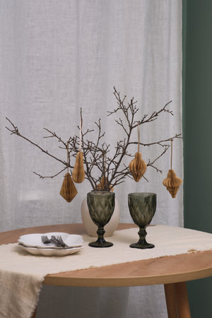 An Elegant Autumn Table Setting featuring Decorative Branches along with Beautiful Glassware