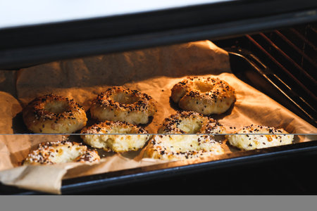 Freshly Baked Bagels Rising and Baking in the Oven, Creating a Comforting and Inviting Aroma