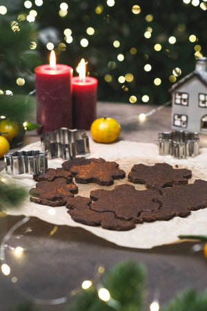 A warm and cozy Christmas scene that features delicious cookies, beautiful candles,cuttings, and festive decorations all around.の写真素材