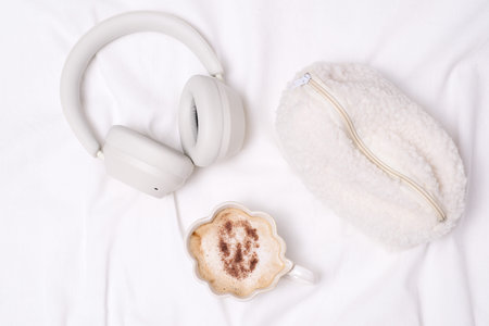 Cozy Essentials Comfortable Headphones, Warm Mug, and a Soft Plush Pouch for Relaxation.