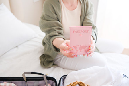Travel Essentials A Woman with Her Passport, Ready to Explore the Beautiful Worldの写真素材