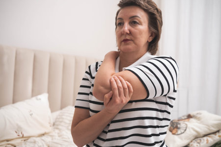 Muscle aches. Adult woman has pain in arm muscles.の写真素材