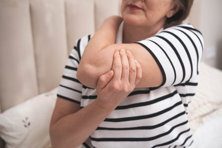 Muscle aches. Adult woman has pain in arm muscles.の写真素材