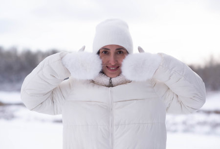 Woman In White Parka Gazing Across Snowy Field, Hands Clutching Collar, Soft Overcast Light, Visible...