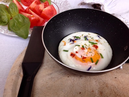 Healthy tasty breakfast with fried egg, tomatoesの写真素材