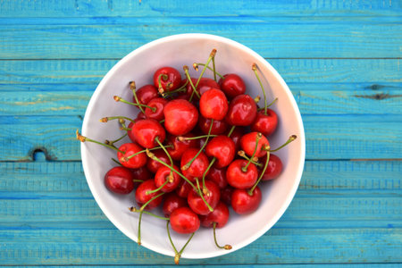 Fresh sweet cherries on the table boards. Garden fresh organic cherries