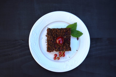 delicious cheesecake with fresh sweet cherries    on a plateの写真素材