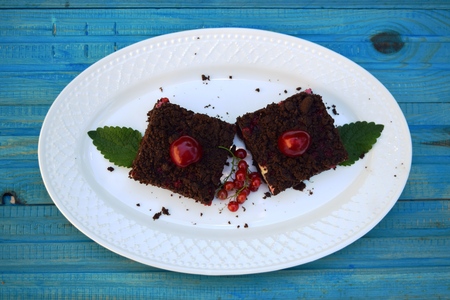 delicious cheesecake with fresh sweet cherries    on a plateの写真素材