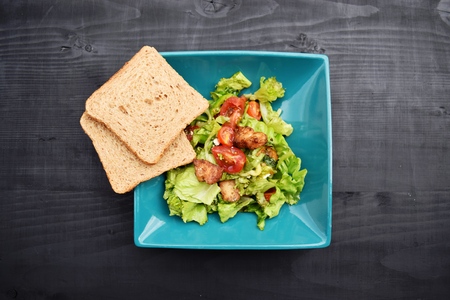 Fresh vegetable salad, healthy food, tomatoes and salad leaves. Healthy chicken salad with fresh vegetablesの写真素材