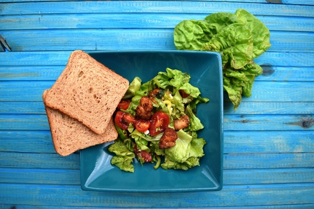 Fresh vegetable salad, healthy food, tomatoes and salad leaves. Healthy chicken salad with fresh vegetablesの写真素材