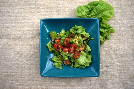 Fresh vegetable salad, healthy food, tomatoes and salad leaves. Healthy chicken salad with fresh vegetablesの写真素材