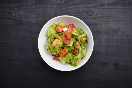 Fresh vegetable salad, healthy food, tomatoes and salad leaves. Healthy chicken salad with fresh vegetablesの写真素材
