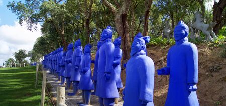 Asian style garden with sculptures, lakes, pagodas, a giant Buddha and terracotta warriorsの写真素材