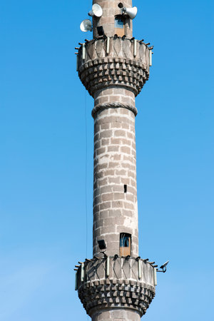 A mosque minaret against clear blue skyの写真素材