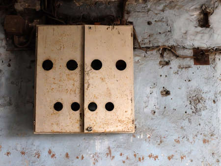 view of electric and breaker boxes on the side of a houseの写真素材