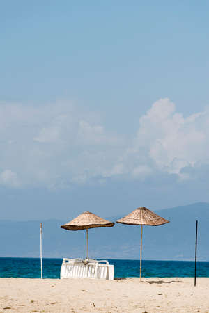Umbrellas by the seaの写真素材