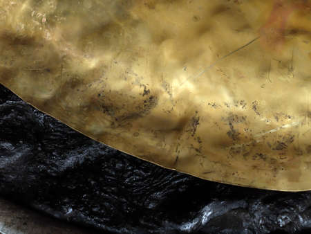 Brass yellow metal plate background textureの写真素材