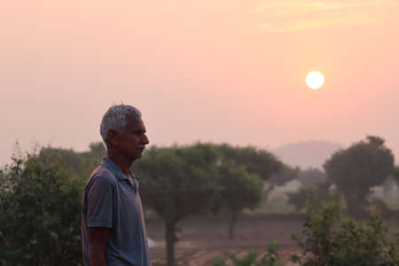 strong confidence farmer or man under the sunrise at seasideの写真素材