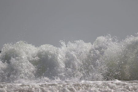 close-up of white water wave or sea wave on beach background, landscape on beach