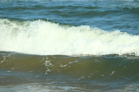 close up of crystal water wave of blue sea on the beach, bay of India , sea background